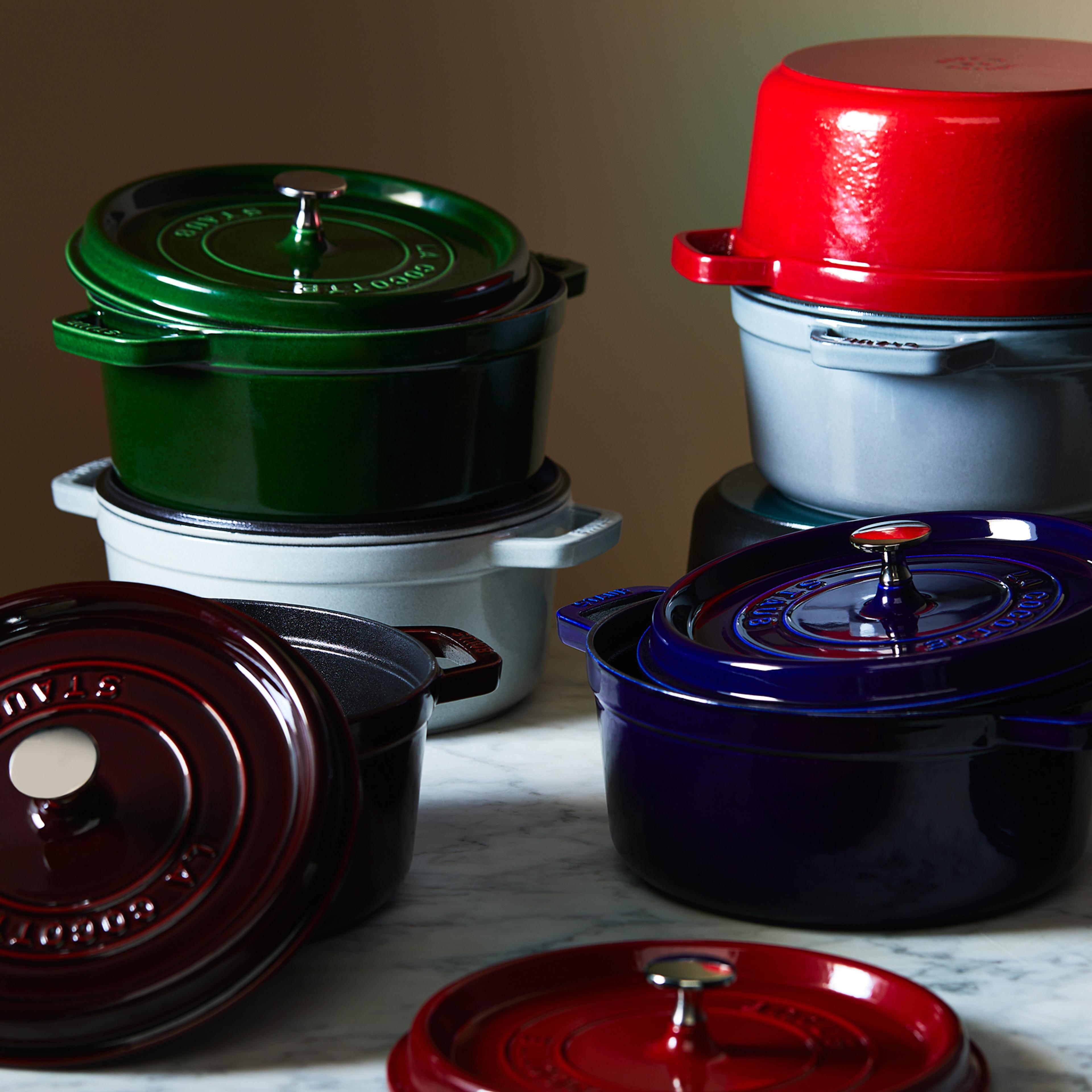 Multicolor Staub cocottes stacked.