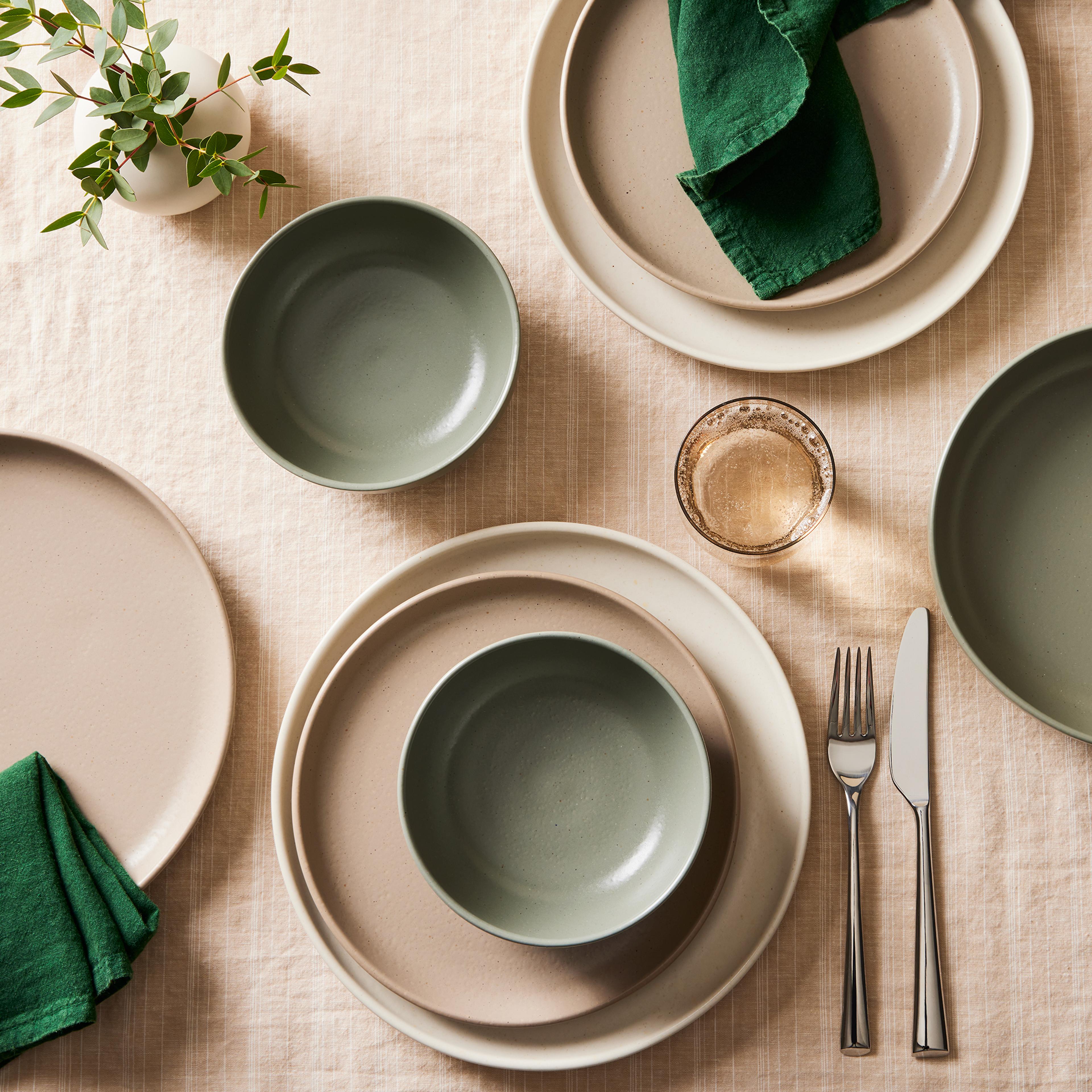 earth-tone dinnerware on a table setting
