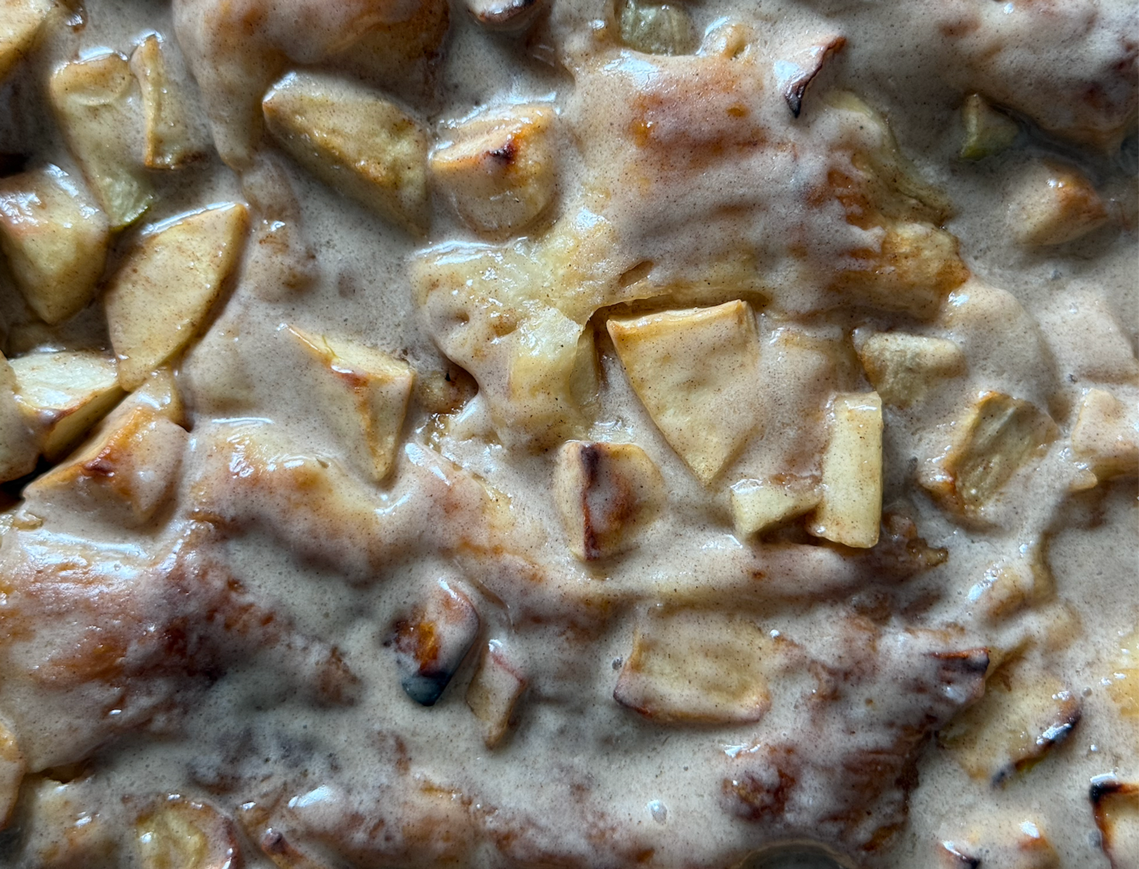 Close up of apple fritter focaccia with a brown butter glaze